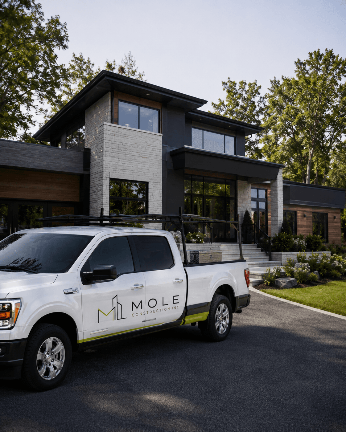 Mole Construction branded vehicle outside a residential property.