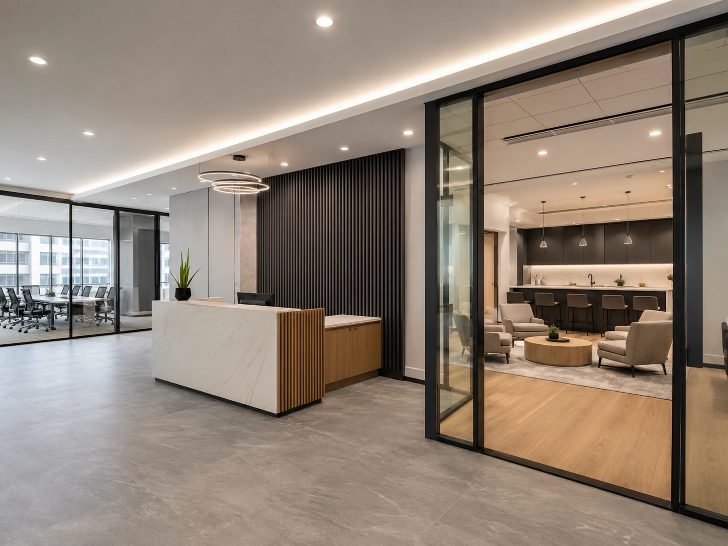 Commercial tenant improvement with reception desk, glass offices and employee lounge.
